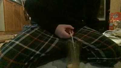 Banjo Empties His Load into A Cup.