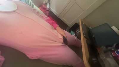 Angel playing with a vibrator.