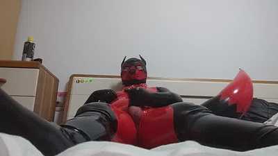 rubber pup jerking off