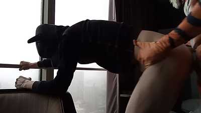 puppy plapped on window