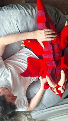 Touching her beautiful dragon body with love and affection