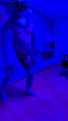 Cow Person wiggles in long, colorful socks