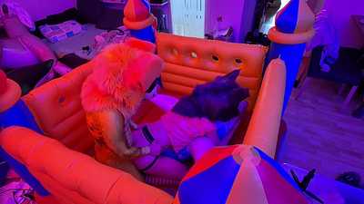 Two good boys having fun in the bouncy castle