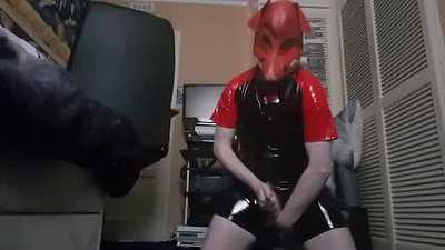 Cumin wearin Inf fkx hood and a pvc suit